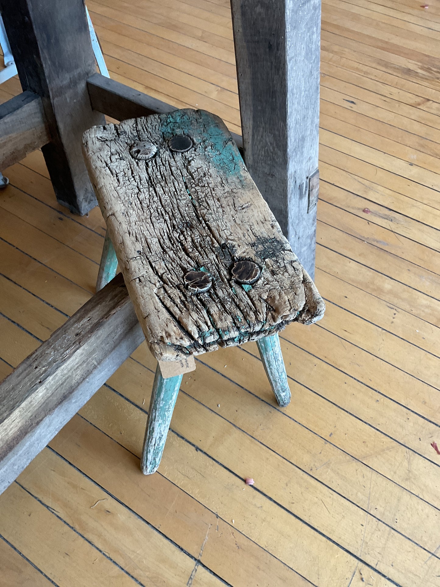 Short primitive green stool