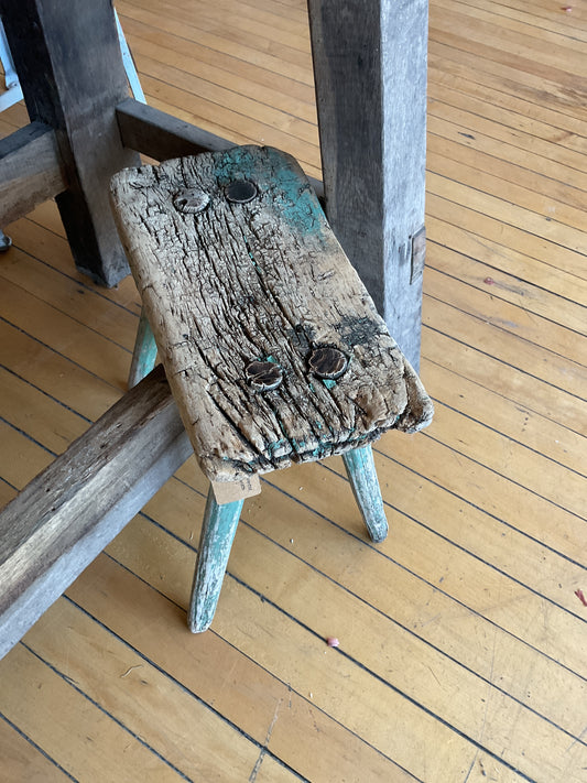 Short primitive green stool